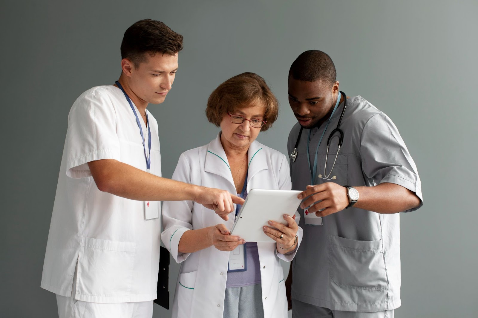 Healthcare professionals reviewing patient information together, demonstrating the collaborative care model nursing approach in home care settings